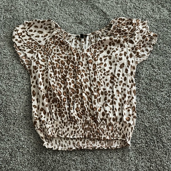 Size small Express brand blouse. Cheetah. Very flattering. V-Neck - Picture 1 of 2